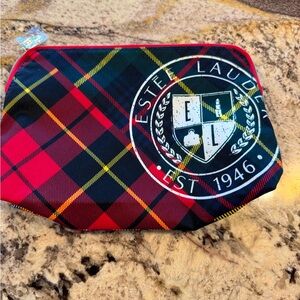 Estee Lauder Red and Black Travel Bag with Timeless Elegance